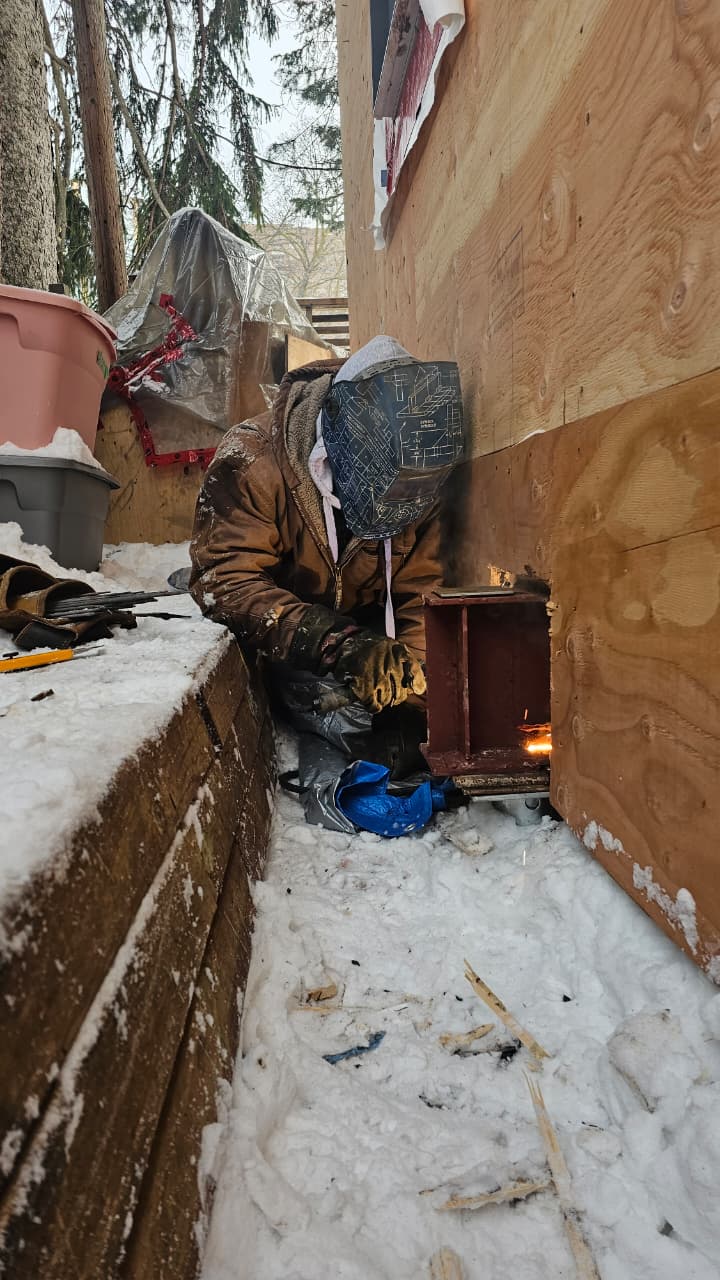 Heavy equipment welding repair at an Oakville industrial site