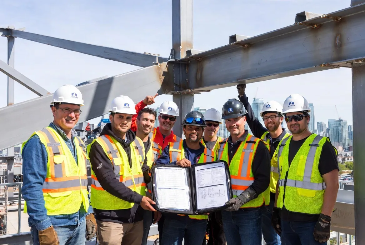 6 welders and supervisors reviewing full documentation package
